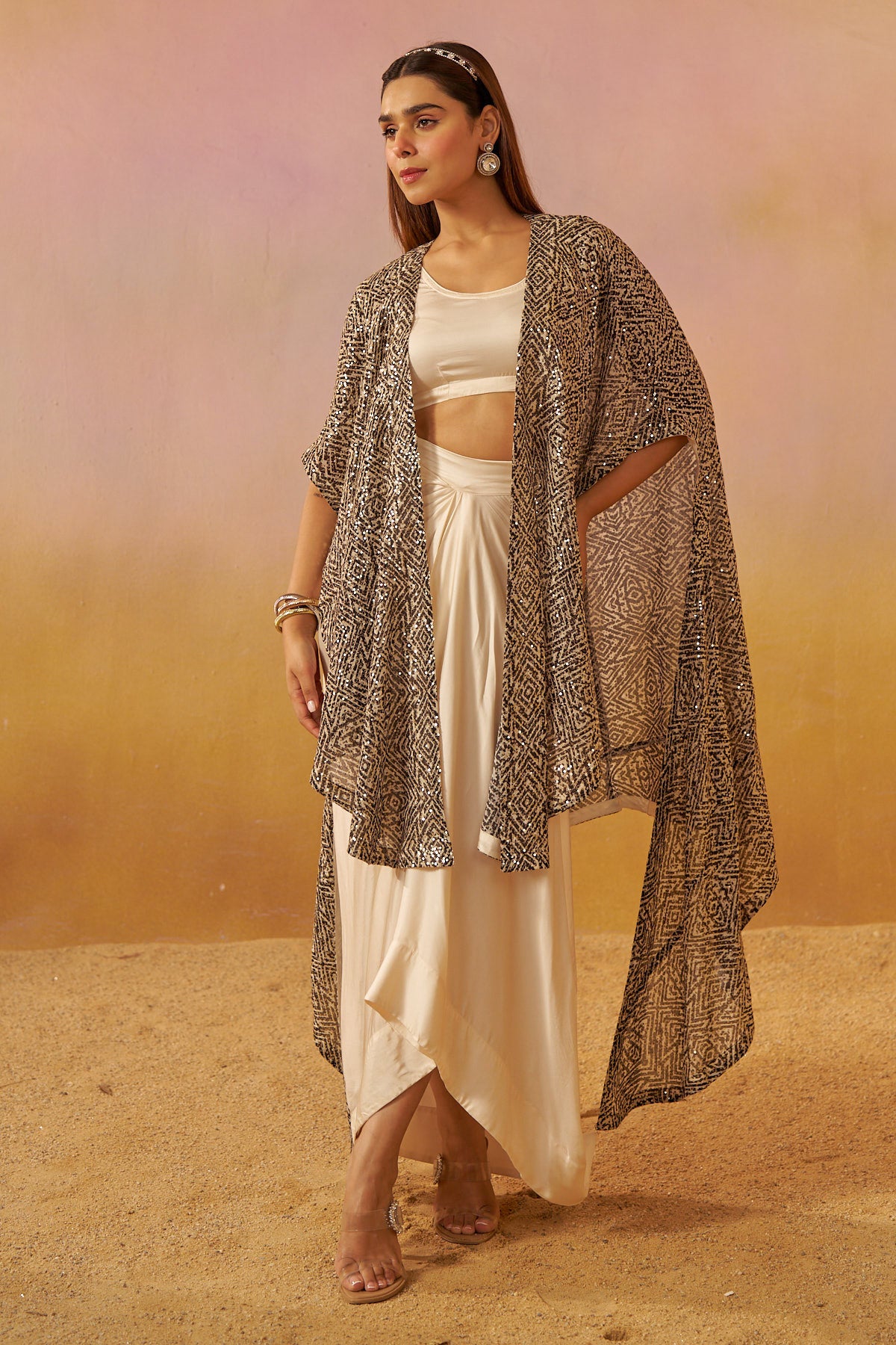 Shimmering Noir Cape with Playful Dhoti Skirt and Bustier