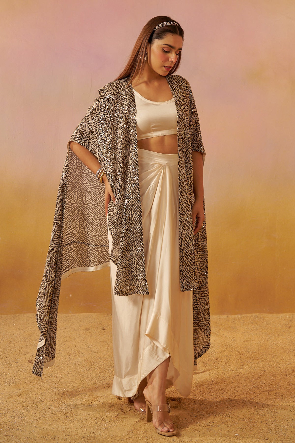 Shimmering Noir Cape with Playful Dhoti Skirt and Bustier